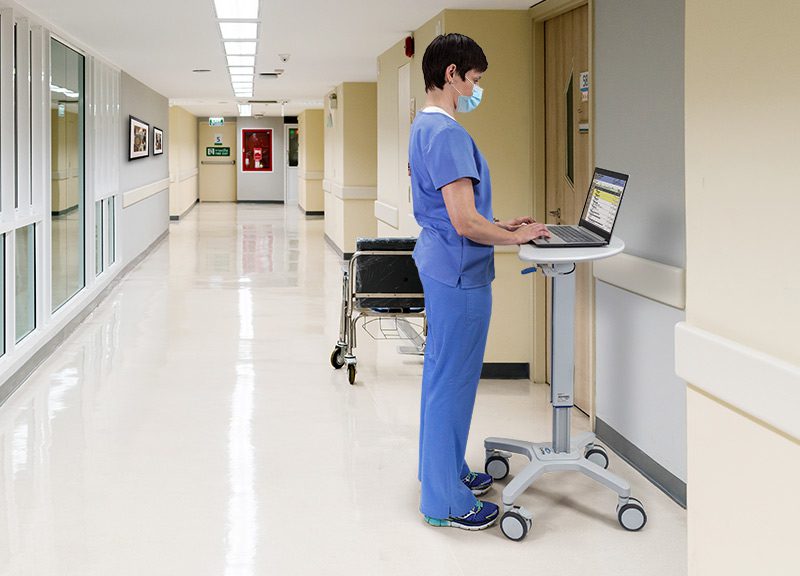 Nurse Using Kidney mobile documentation cart
