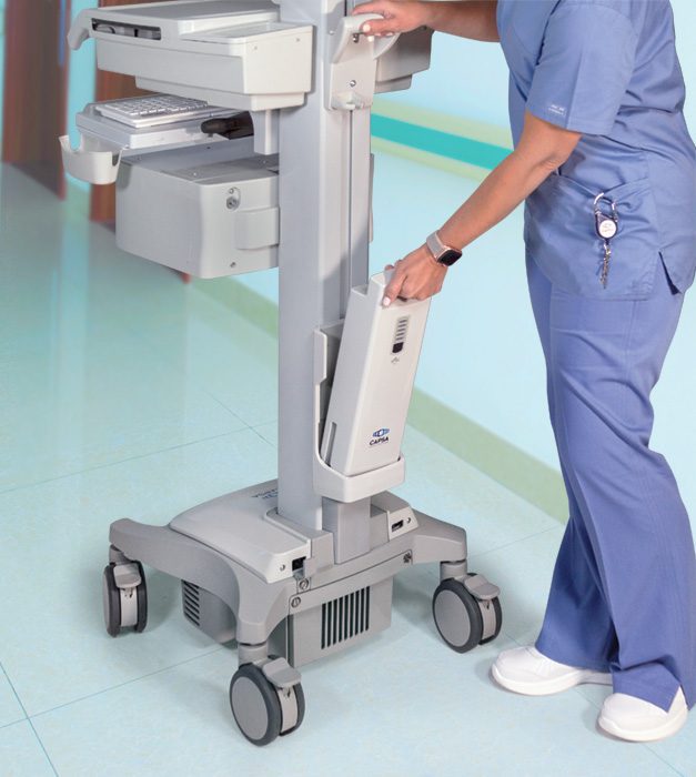 Nurse swapping out GoLiFe™ External Battery On Hospital Computer Cart